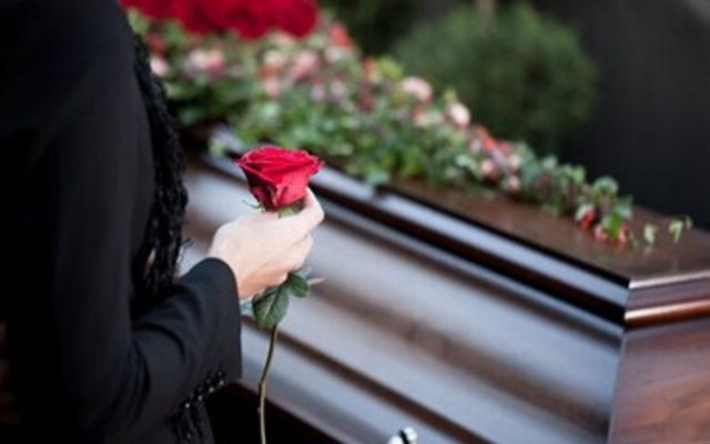 Funeral casket and roses