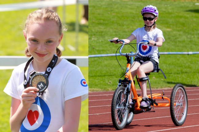 Emily holding medal and on trike in Fund tshirt