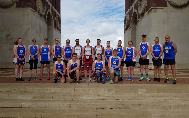 Somme Poppy Run group on memorial steps