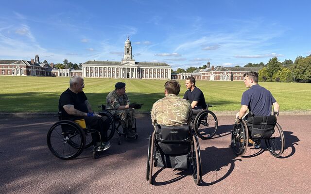 Sean and personnel in wheelchairs at Cranwell