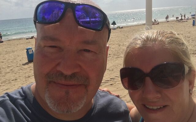 Craig and Sandra on beach in sunglasses