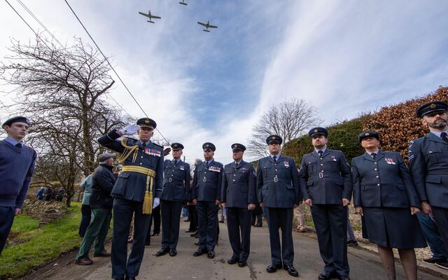 RAF personnel saluting flypast