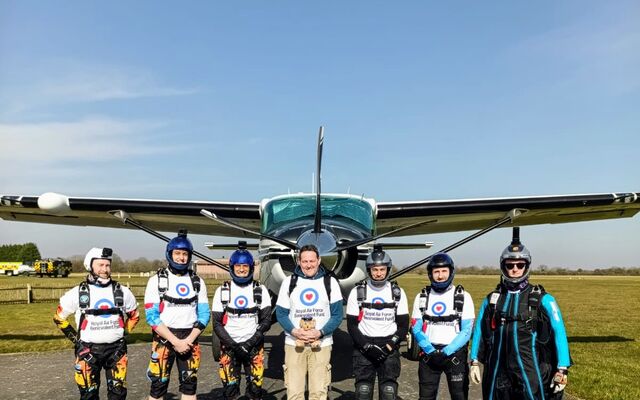 JSPCW parachutists in front of plane