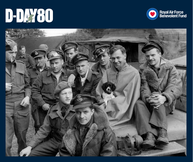 Pilots of 416 (City of Oshawa) Squadron RCAF await their next briefing at B2/Bazenville, 28 June 1944. One of the pilots is holding the squadron's mascot, "Type".