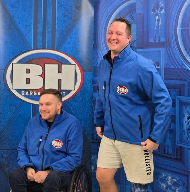 Dan and Mike in blue team outfits on Bargain Hunt set