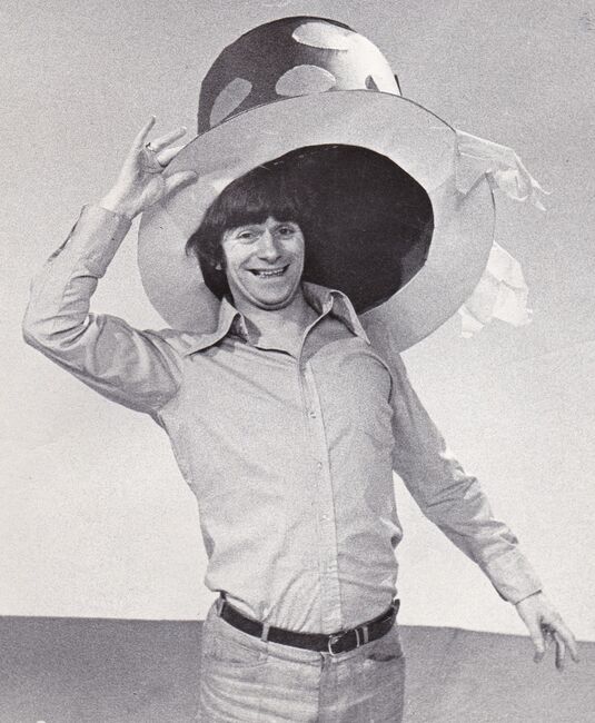 Johnny on his TV show holding massive hat