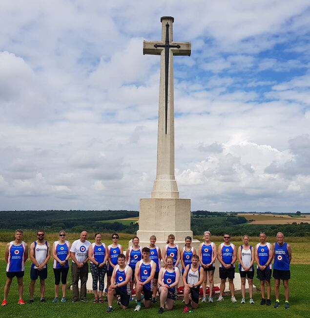 Group of runners in front of Somme memorial