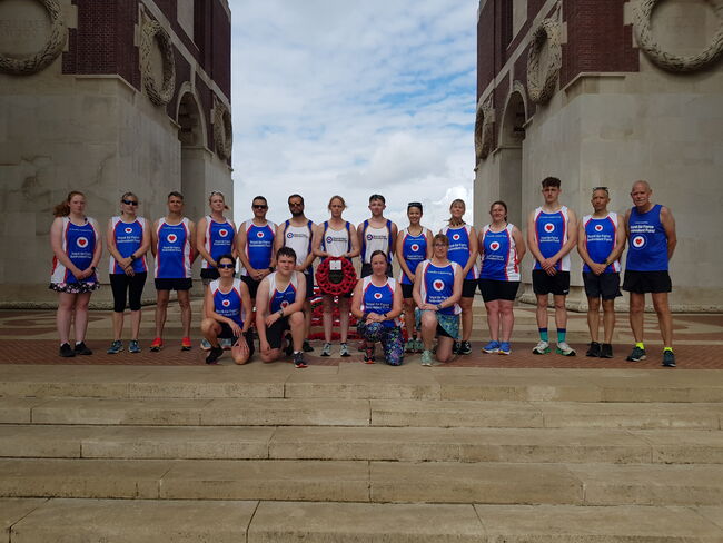 Somme Poppy Run group on memorial steps