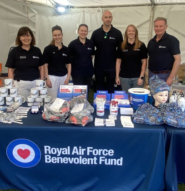 Fund staff at stall with merch