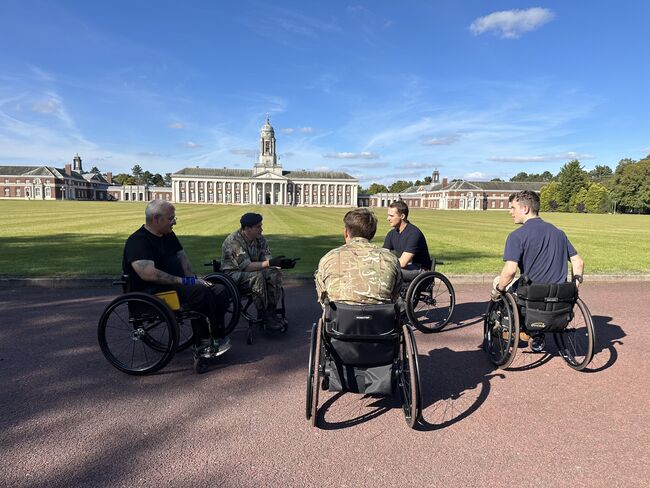 Sean and personnel in wheelchairs at Cranwell