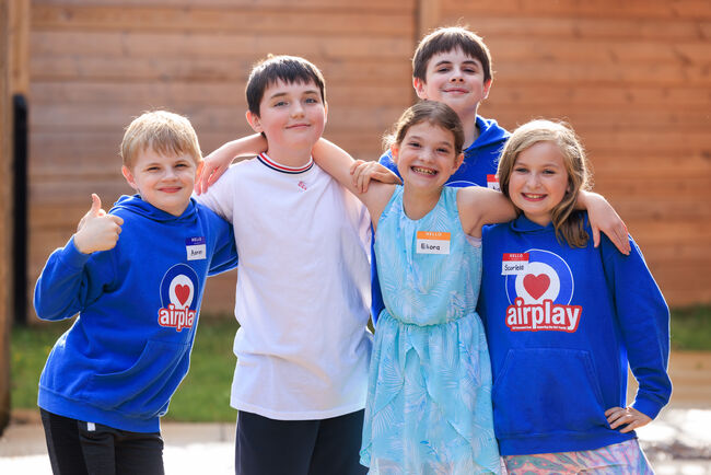 5 kids at Airplay posing together