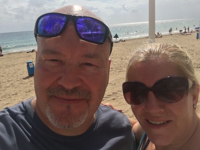 Craig and Sandra on beach in sunglasses