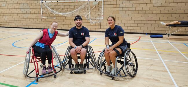 Neil in wheelchair with Team UK